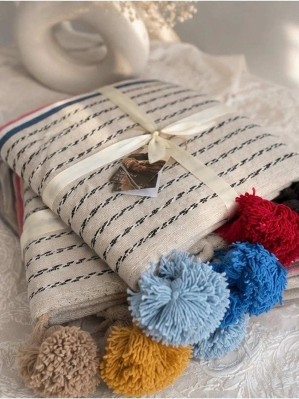 Cream Striped Throw with Multi-Colored Pom Poms
